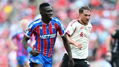 Ismaila Sarr of Crystal Palace runs with the ball under pressure from Alexis Mac Allister of Liverpool during the 2025 FA Community Shield match between Crystal Palace and Liverpool at Wembley Stadium on August 10, 2025 in London, England.