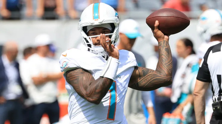 Tua Tagovailoa #1 of the Miami Dolphins warms up prior to the game against the Chicago Bears during the NFL Preseason 2025 game at Soldier Field on August 10, 2025 in Chicago, Illinois.