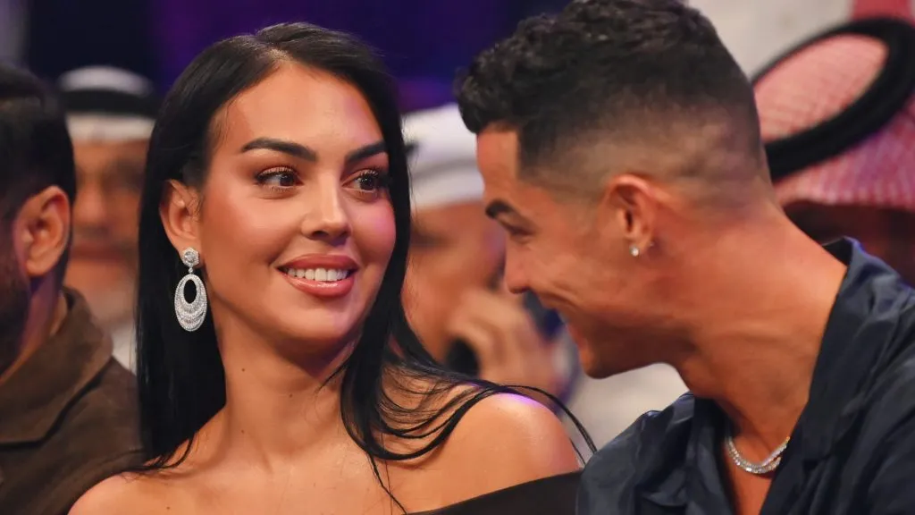 Cristiano Ronaldo and Georgina Rodríguez speak ringside prior to the Heavyweight fight between Tyson Fury and Francis Ngannou at Boulevard Hall on October 28, 2023. (Source: Justin Setterfield/Getty Images)