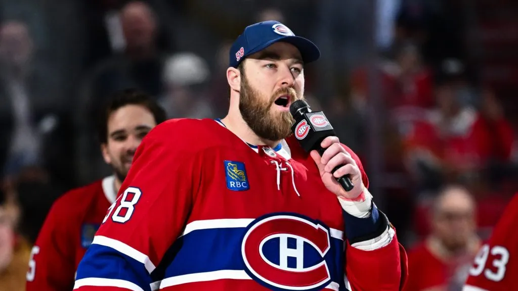 David Savard #58 of the Montreal Canadiens addresses the fans after a 4-2 victory against the Carolina Hurricanes clinching the last spot in the Eastern Conference playoffs at the Bell Centre on April 16, 2025 in Montreal, Quebec, Canada.