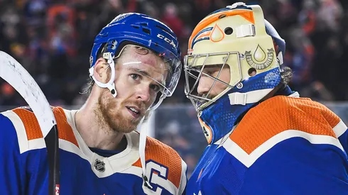 Connor McDavid #97 and Stuart Skinner #74 of the Edmonton Oilers celebrate after defeating the Calgary Flames in the 2023 Tim Hortons NHL Heritage Classic at Commonwealth Stadium on October 29, 2023 in Edmonton, Alberta, Canada.