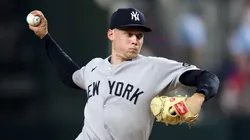 Will Warren #98 of the New York Yankees throws a pitch during the fourth inning against the Texas Rangers at Globe Life Field on August 05, 2025 in Arlington, Texas.