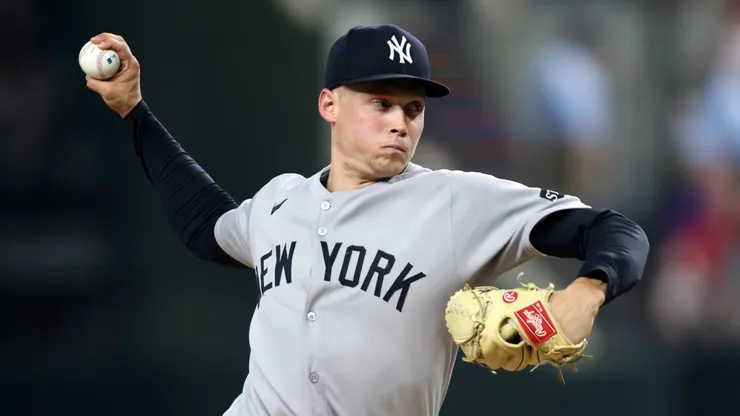 Will Warren #98 of the New York Yankees throws a pitch during the fourth inning against the Texas Rangers at Globe Life Field on August 05, 2025 in Arlington, Texas.