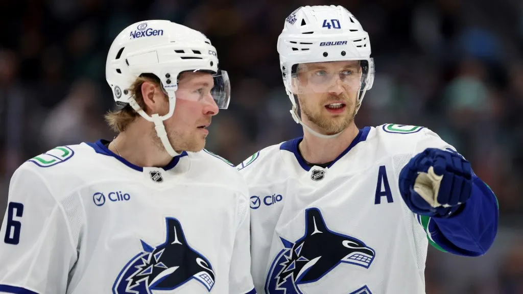 Brock Boeser #6 and Elias Pettersson #40 of the Vancouver Canucks talk during the first period against the Seattle Kraken at Climate Pledge Arena on March 01, 2025 in Seattle, Washington. (Photo by Steph Chambers/Getty Images)