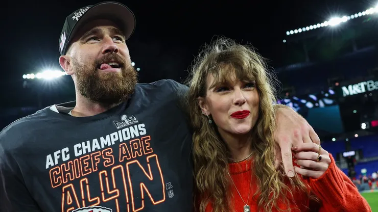 Travis Kelce #87 of the Kansas City Chiefs (L) celebrates with Taylor Swift after defeating the Baltimore Ravens in the AFC Championship Game at M&T Bank Stadium on January 28, 2024 in Baltimore, Maryland.