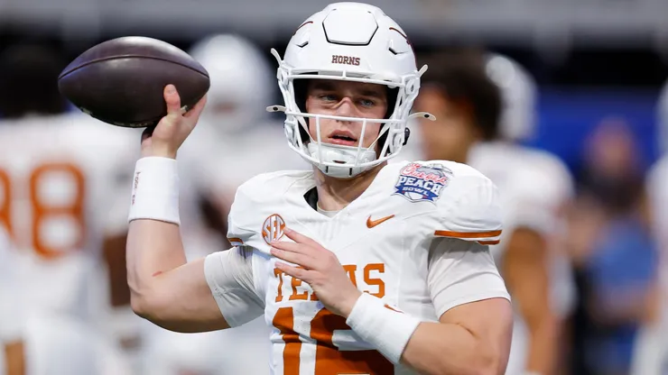 Arch Manning #16 of the Texas Longhorns warms up prior to the Chick-fil-A Peach Bowl against the Arizona State Sun Devils at Mercedes-Benz Stadium on January 01, 2025 in Atlanta, Georgia.