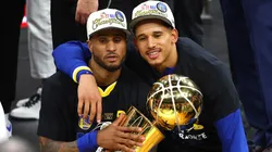 Gary Payton II #0 and Juan Toscano-Anderson #95 of the Golden State Warriors celebrate after defeating the Boston Celtics 103-90 in Game Six of the 2022 NBA Finals.