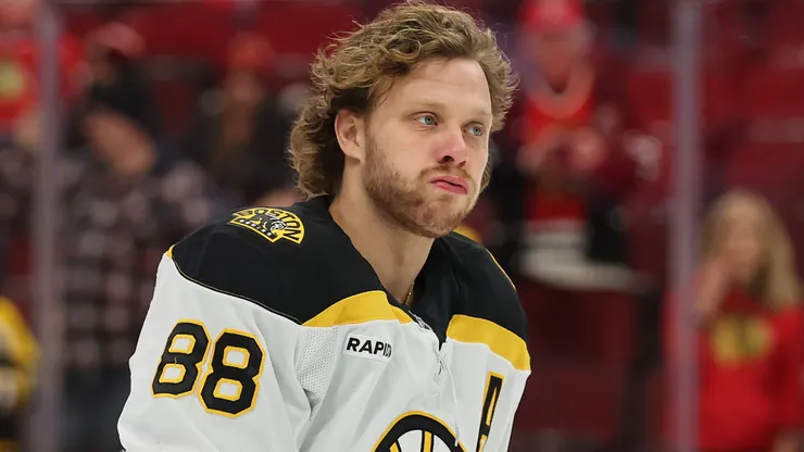 David Pastrnak #88 of the Boston Bruins warms up prior to the game against the Chicago Blackhawks at the United Center on December 04, 2024 in Chicago, Illinois.