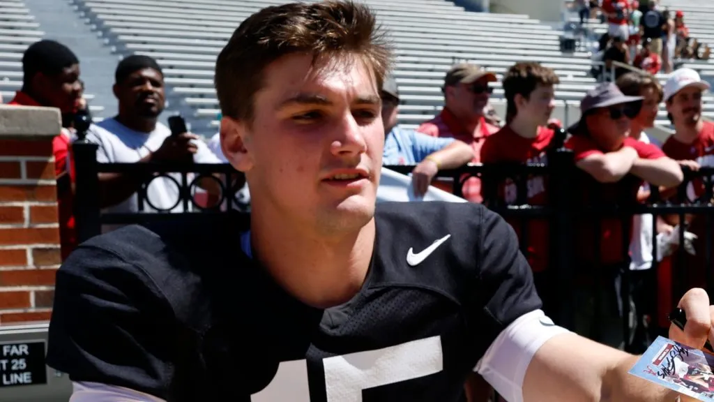 Quarterback Ty Simpson #15 signs autographs during the Alabama Spring Game at Bryant Denny Stadium on April 12, 2025 in Tuscaloosa, Alabama.