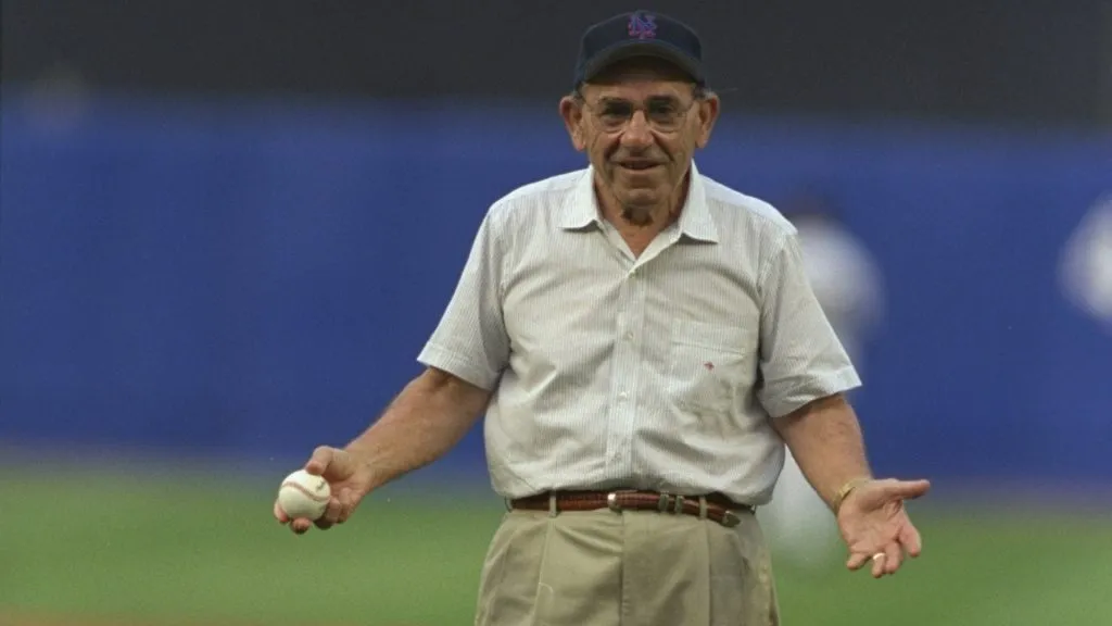 Former Yankee Yogi Berra throws the first pitch to start the interleague game between the New York Mets and the New York Yankees at Shea Stadium in 1998. (Source: Al Bello /Allsport)