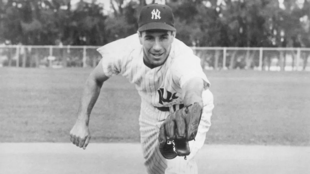 Phil Rizzuto #10 of the New York Yankees poses for an action portrait circa 1951. (Source: Bruce Bennett Studios/Getty Images)