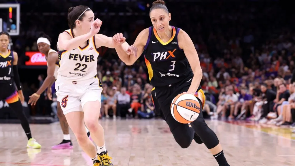 Guard Diana Taurasi #3 of the Phoenix Mercury drives against guard Caitlin Clark #22 of the Indiana Fever during the fourth quarter at Footprint Center. (Chris Coduto/Getty Images)