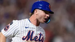 Pete Alonso #20 of the New York Mets reacts after hitting a solo home run.
