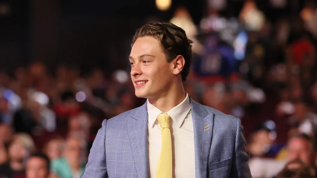 James Hagens walks to the stage after being drafted by the Boston Bruins with the number seven overall pick during the first round of the 2025 Upper Deck NHL Draft at the Peacock Theater on June 27, 2025 in Los Angeles, California.