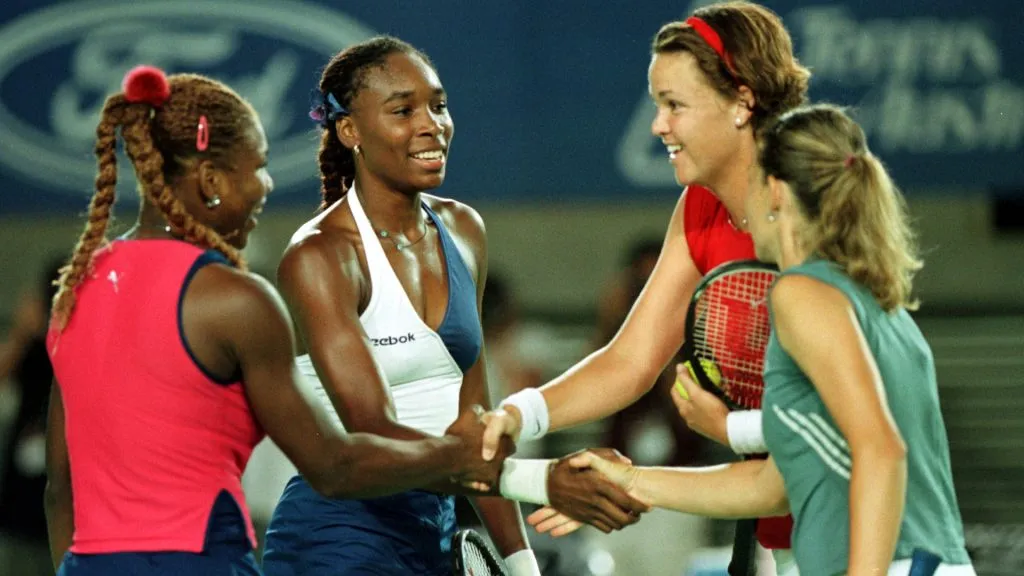 Serena and Venus Williams of the USA and Lindsay Davenport and Corina Morariu of the USA shake hands at the net after their 2001 Australian Open final. (Clive Brunskill/ALLSPORT/Getty)