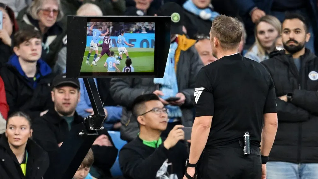 Referee Craig Pawson checks the VAR monitor before awarding a penalty to Aston Villa after a foul on Jacob Ramsey by Ruben Dias of Manchester City. (Michael Regan/Getty Images)