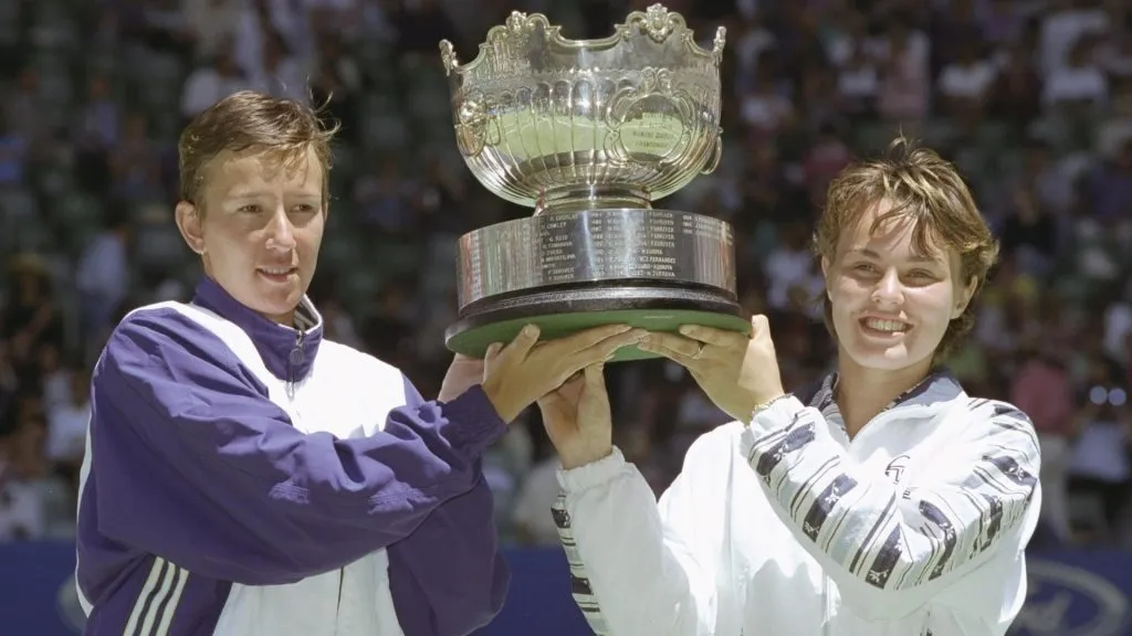 Natasha Zvereva of Belarus (left) partnered by Martina Hingis of Swizerland hold aloft the ladies doubles trophy after Australian Open victory. (Clive Mason/Allsport/Getty Images)