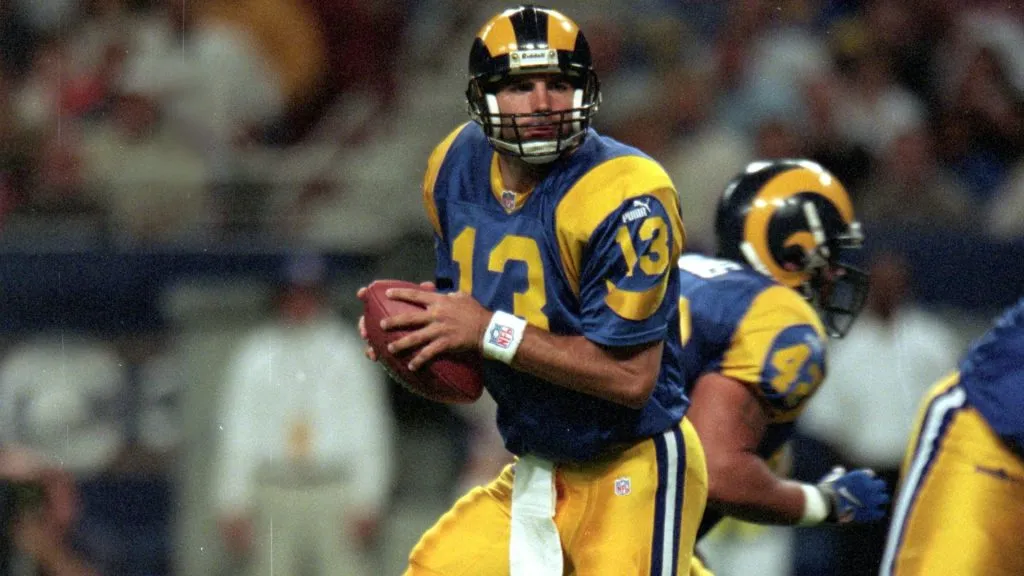 Kurt Warner #13 of the St.Louis Rams moves back to pass the ball during a game against the Cleveland Browns in 1999. (Source: Elsa Hasch /Allsport)