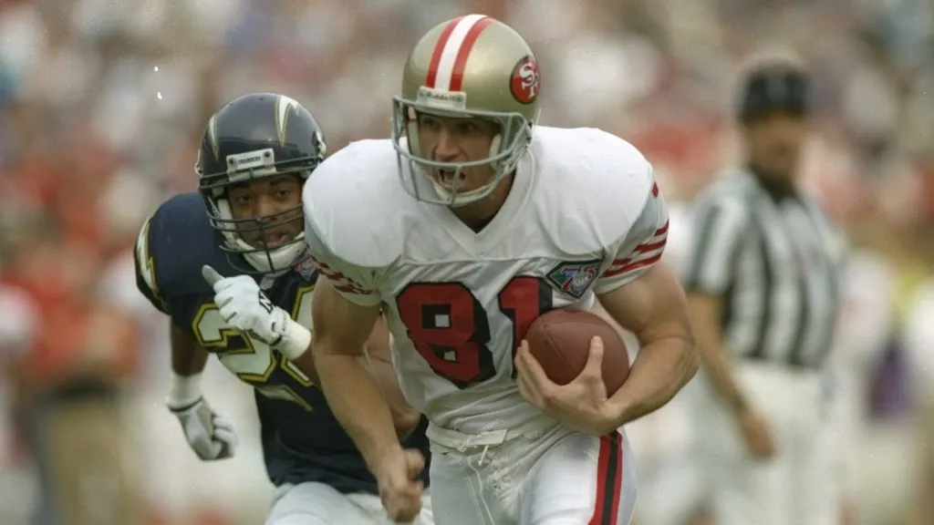 Wide receiver Ed McCaffrey of the San Francisco 49ers moves the ball during a game against the San Diego Chargers at Jack Murphy Stadium in 1994. (Source: Stephen Dunn /Allsport)