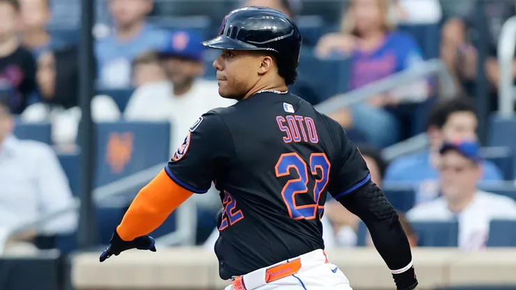 Juan Soto #22 of the New York Mets follows through on his first inning base hit against the Atlanta Braves.
