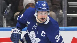 Auston Matthews' Maple Leafs closely watch the situation with a teammate.