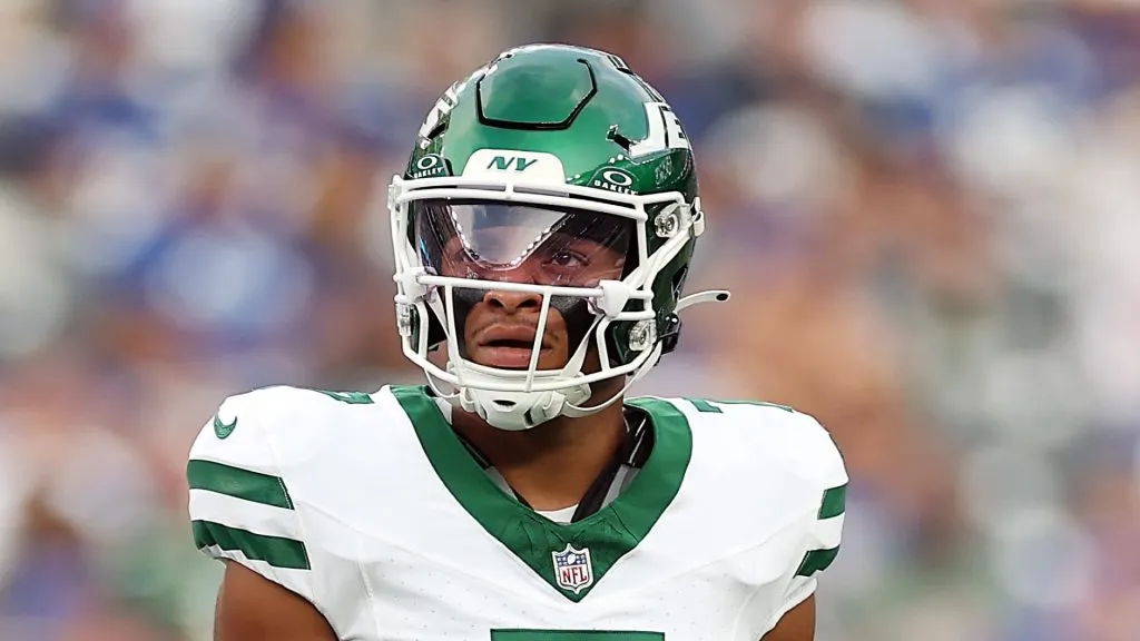 Justin Fields looks on while playing for Jets