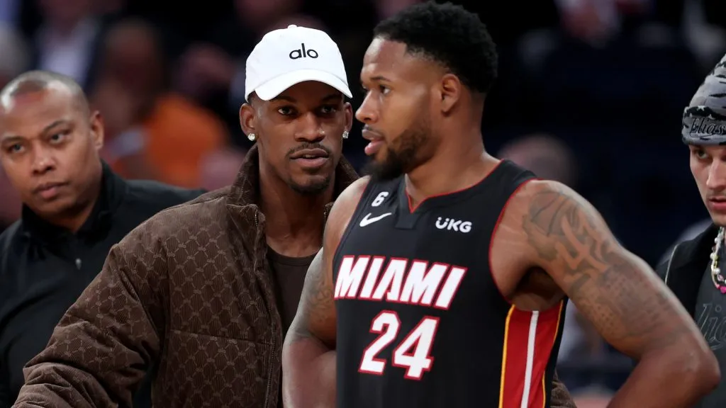 Jimmy Butler and Haywood Highsmith  talking each other in a NBA game