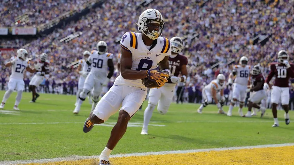Malik Nabers #8 of the LSU Tigers scores a touchdown during the first half against the Texas A&M Aggies at Tiger Stadium on November 25, 2023. (Source: Jonathan Bachman/Getty Images)
