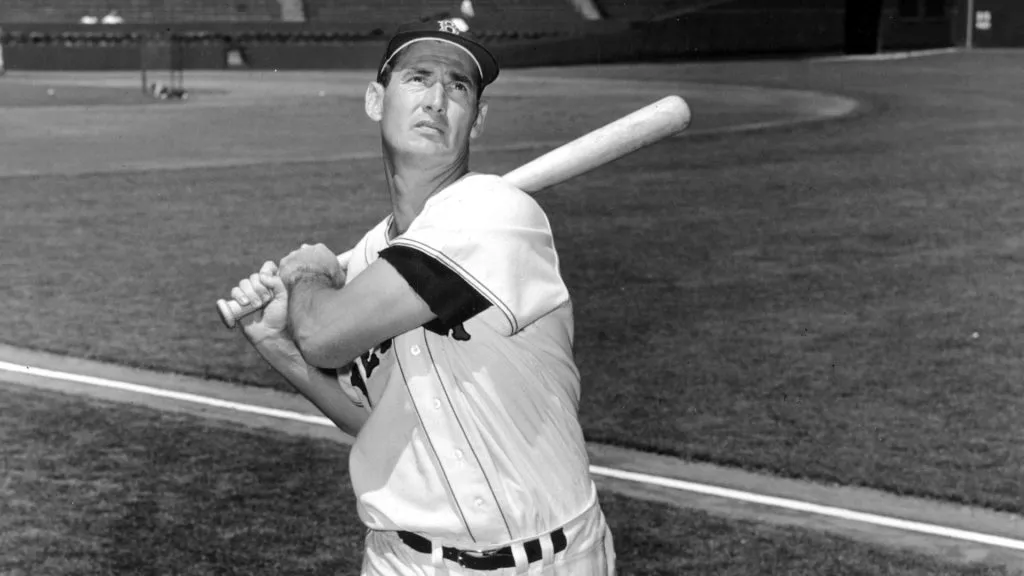 Baseball legend Ted Williams (1918 – 2002) of the Boston Red Sox swings a bat circa 1955. (Source: Getty Images)