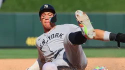 Aaron Judge #99 of the New York Yankees slides into third base on an error by the St. Louis Cardinals.