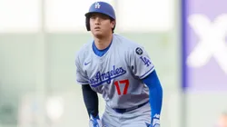 Shohei Ohtani #17 of the Los Angeles Dodgers leads off first base.
