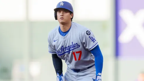 Shohei Ohtani #17 of the Los Angeles Dodgers leads off first base.