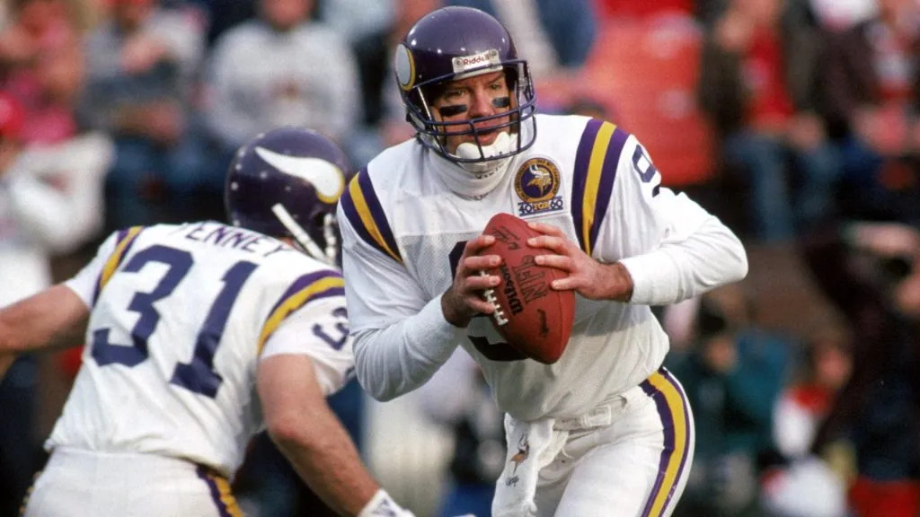Quarterback Tommy Kramer #9 of the Minnesota Vikings moves with the ball as he looks to pass against the San Francisco 49ers during the 1989 NFC Divisional Playoff game. (Source: George Rose/Getty Images)