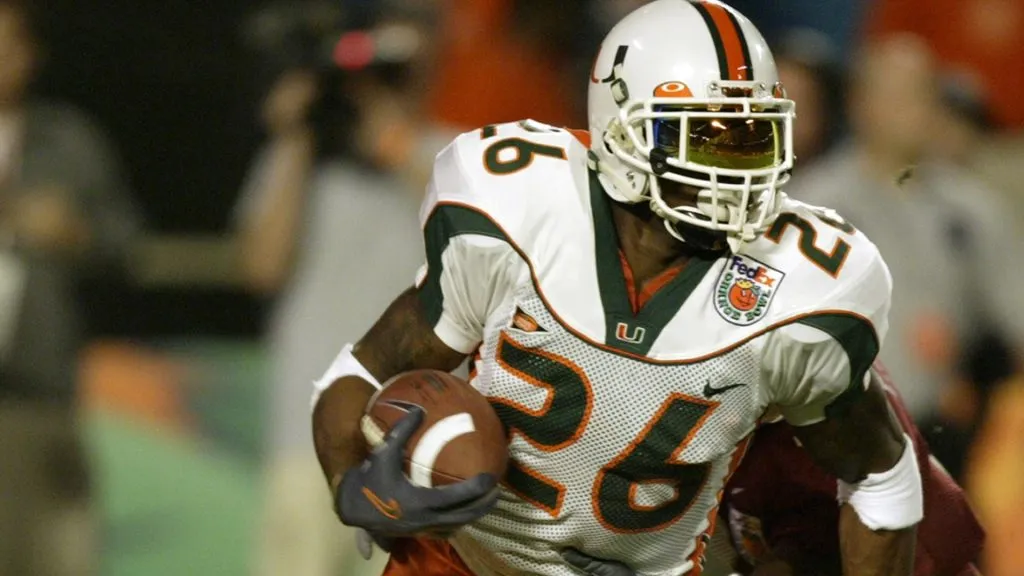 Defensive back Sean Taylor #26 of the Miami Hurricanes attempts to elude wide receiver P.K. Sam #4 of the Florida State Seminoles during the 2004 Orange Bowl game. (Source: Matthew Stockman/Getty Images)
