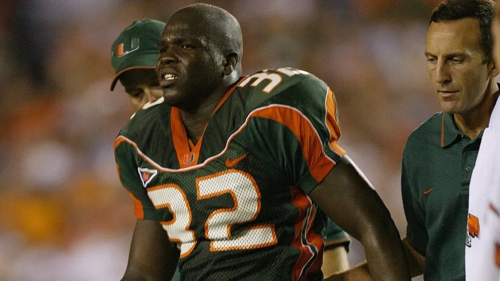Running back Frank Gore #32 of the University of Miami Hurricanes limps off the field during a game against the West Virgina Mountaineers October 2, 2003. (Source: Eliot J. Schechter/Getty Images)