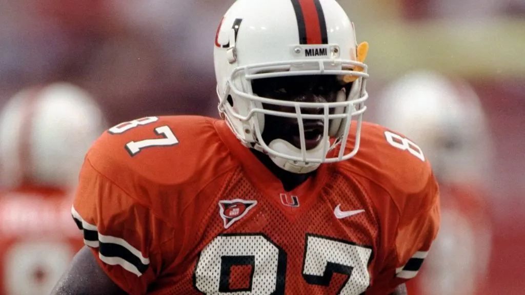 Split end Reggie Wayne #87 of the Miami Hurricanes in action during a game against the Eastern Tennessee State Buccaneers at the Orange Bowl in 1998. (Source: Eliot J. Schechter)