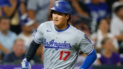 Shohei Ohtani #17 of the Los Angeles Dodgers sprints home to score in the seventh inning.