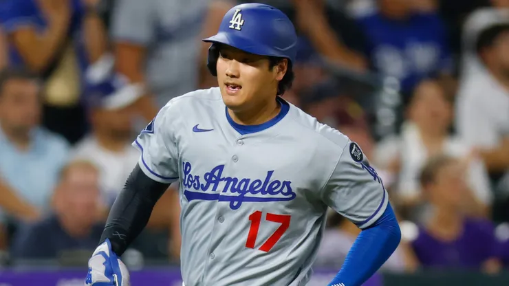 Shohei Ohtani #17 of the Los Angeles Dodgers sprints home to score in the seventh inning.