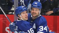 Mitchell Marner and Auston Matthews celebrate a Maple Leafs goal.