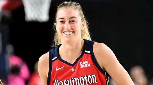 Lucy Olsen #33 of the Washington Mystics celebrates in the third quarter against the Indiana Fever at CFG Bank Arena on May 28, 2025.