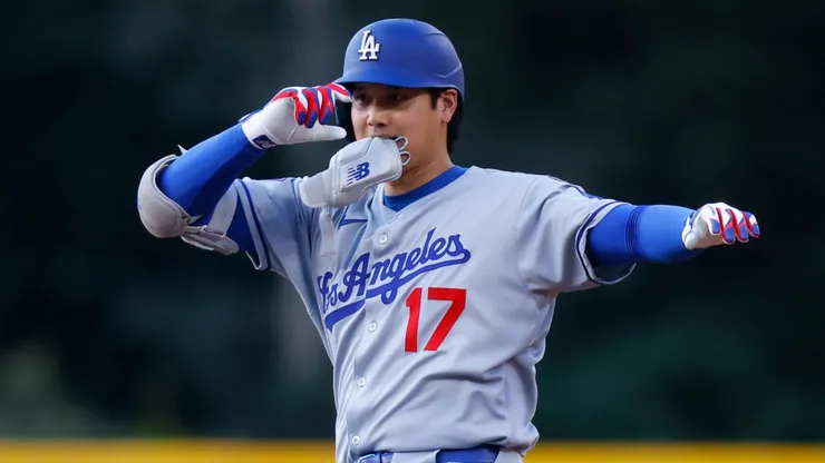 Shohei Ohtani #17 of the Los Angeles Dodgers gestures towards the dugout after hitting a lead off double.