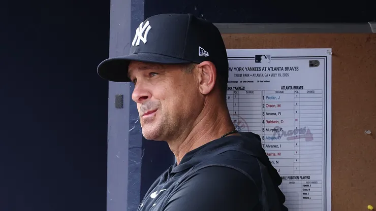 Aaron Boone looks on.
