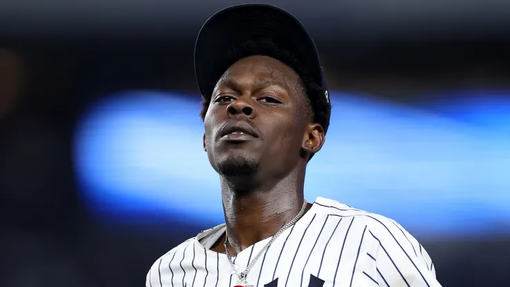 Jazz Chisholm Jr. #13 of the New York Yankees heads back to the dugout.