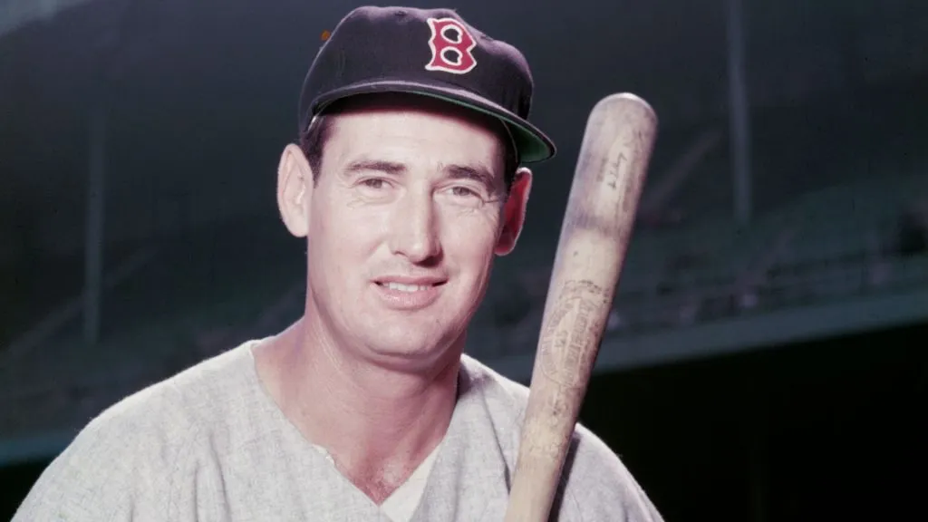 Baseball legend Ted Williams (1918 – 2002) of the Boston Red Sox holds a baseball bat circa 1955. (Source: Getty Images)