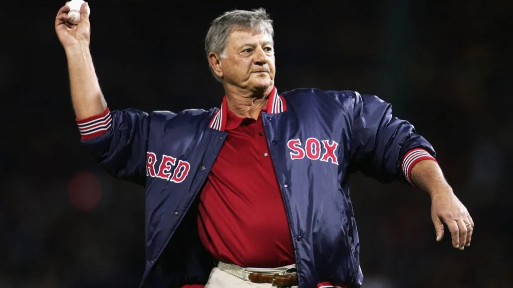Boston Red Sox hall of famer Carl Yastrzemski throws out the first pitch before game one of the World Series between the St. Louis Cardinals and the Red Sox on October 23, 2004. (Source: Al Bello/Getty Images)