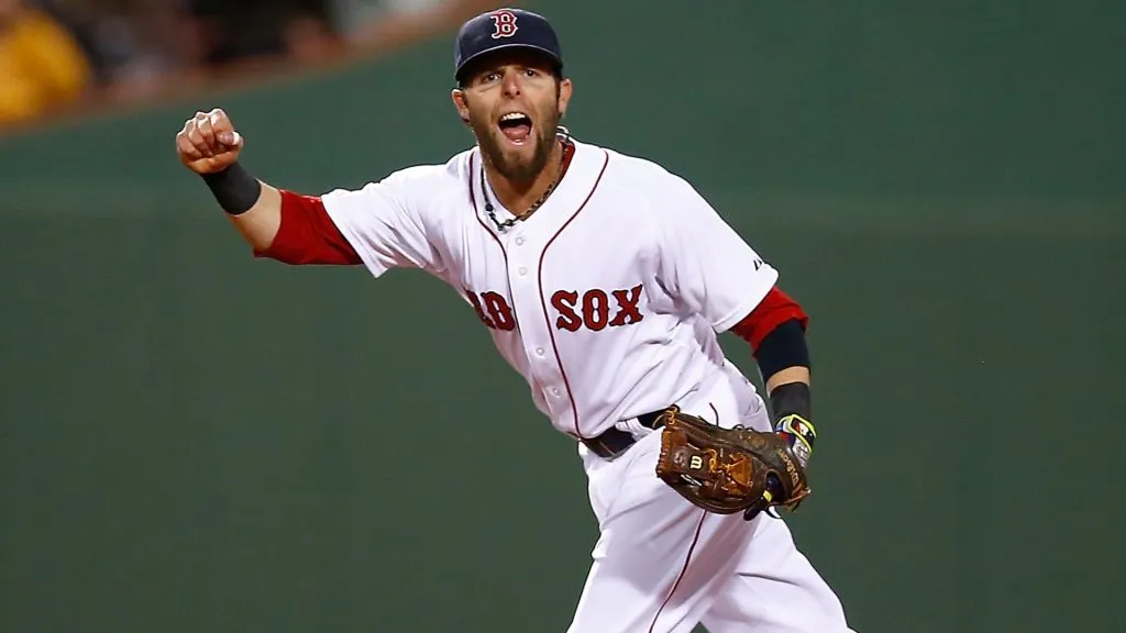 Dustin Pedroia reacts after throwing the runner out at first base in the fifth inning against the Cincinnati Reds during the interleague game in 2014. (Source: Jared Wickerham/Getty Images)