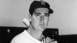 Baseball legend Ted Williams (1918 - 2002) of the Boston Red Sox holds a baseball bat at Shriner's Day in Fenway Park August 22, 1958.