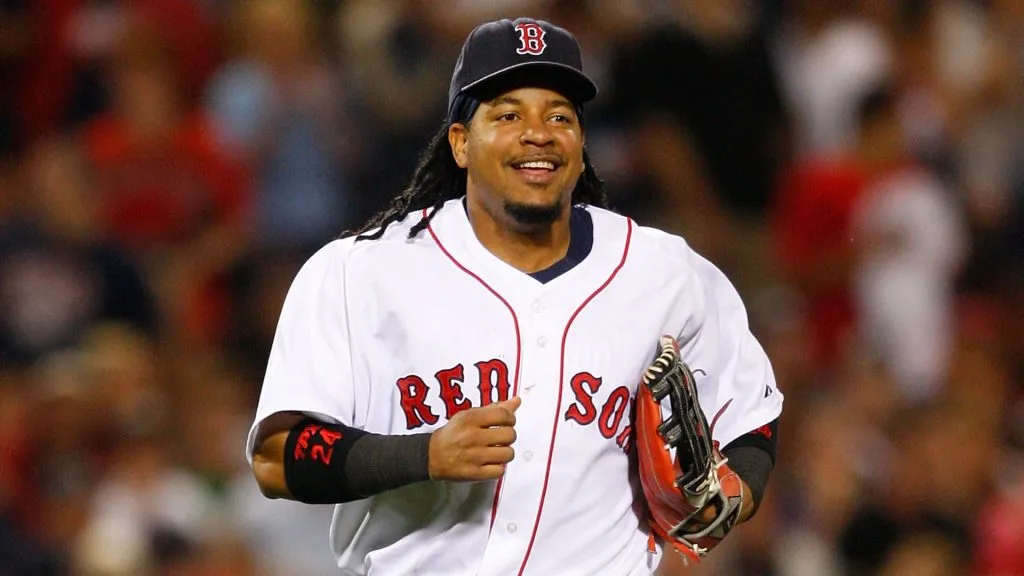 Manny Ramirez #24 of the Boston Red Sox smiles after making a catch off of Alex Rodriguez of the New York Yankees at Fenway Park on July 27, 2008. (Source: Jim Rogash/Getty Images)