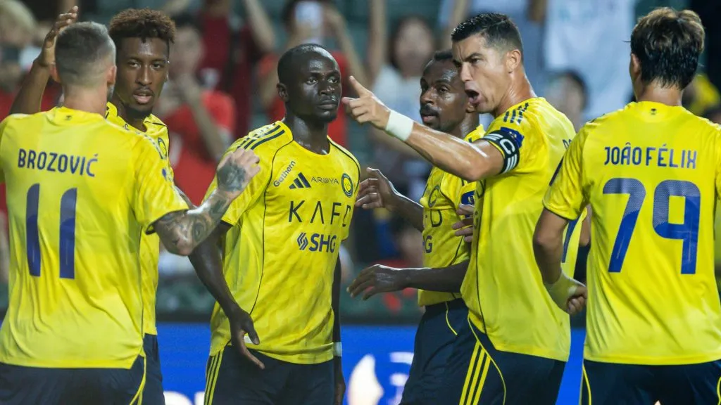 Sadio Mane of Al-Nassr (C) celebrates after scoring his goal with Cristiano Ronaldo of Al-Nassr and teammates during to the Saudi Super Cup semi final between Al-Nassr and Al-Ittihad.