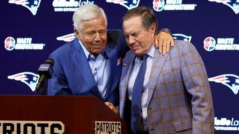 Owner Robert Kraft (L) hugs head coach Bill Belichick (R) of the New England Patriots.